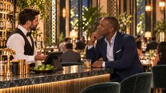 Scene 39 bartender discusses a prior balance with one returning guest thumbnail